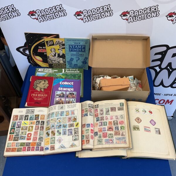 Vintage stamp collection displayed in multiple albums and loose.