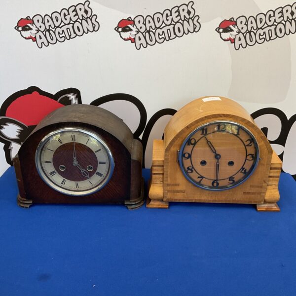 Vintage striking mantle clocks by Haller and Smith on display.