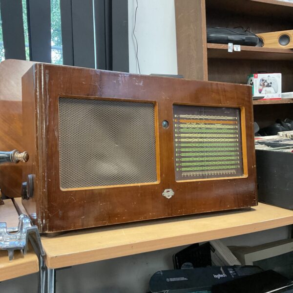 Front view of a vintage Mullard valve radio with tuning scale.