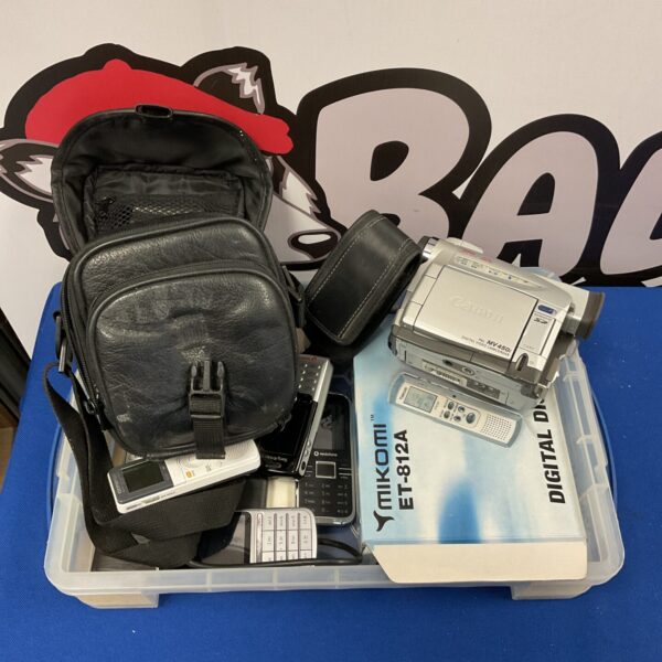 Canon MV450i camcorder in a tray with other electronics.