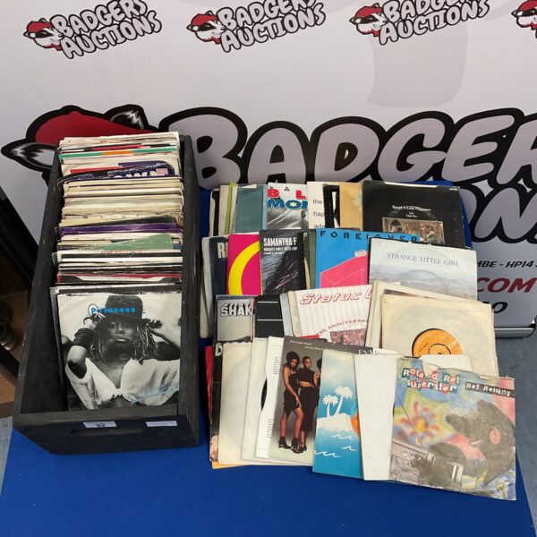 Vintage 7” vinyl single collection in a protective sleeve.