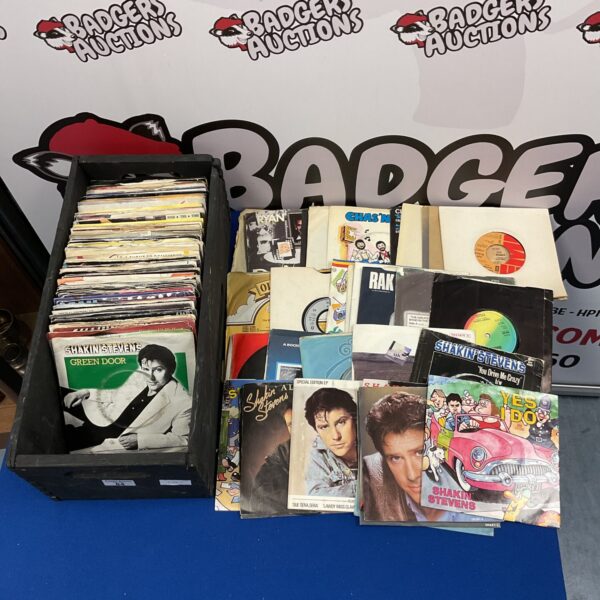 Collection of vintage 7” vinyl single records including Shakin Stevens.