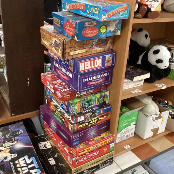 Large assortment of vintage and modern board games for family fun.