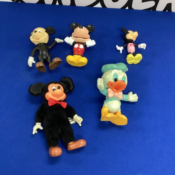 Vintage Disney toys featuring Mickey, Minnie, and Donald Duck.