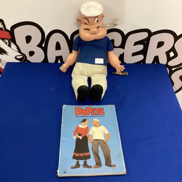 Vintage Popeye puppet and book, collectible cartoon memorabilia.