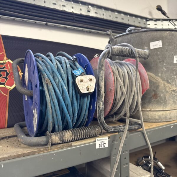 Two blue and black extension reels stacked for cable management.