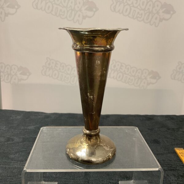 Antique silver trumpet vase on a clear acrylic stand.