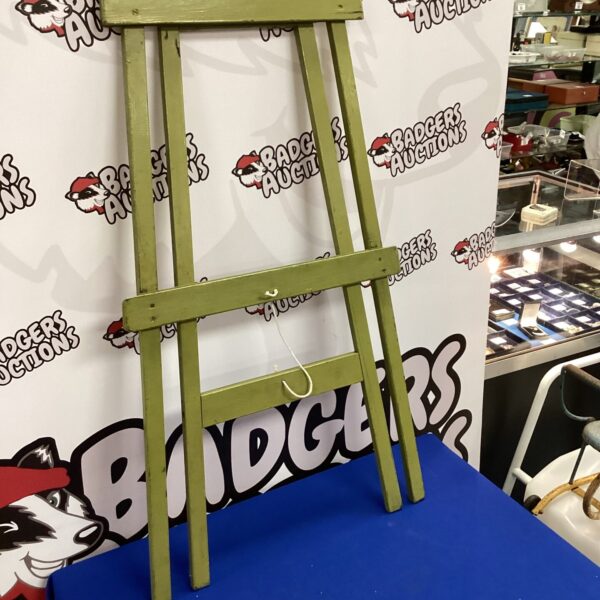 Vintage green wooden chalkboard stand for children.