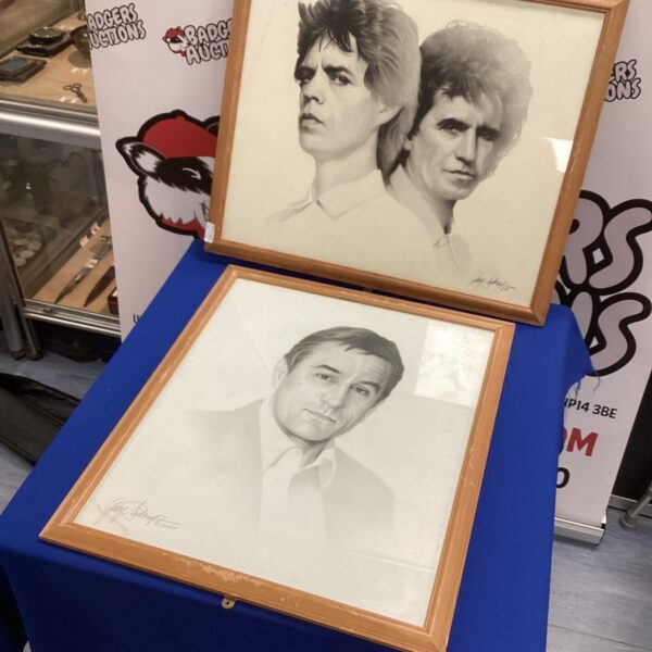 Framed drawing of Mick Jagger and Keith Richards in vintage style.