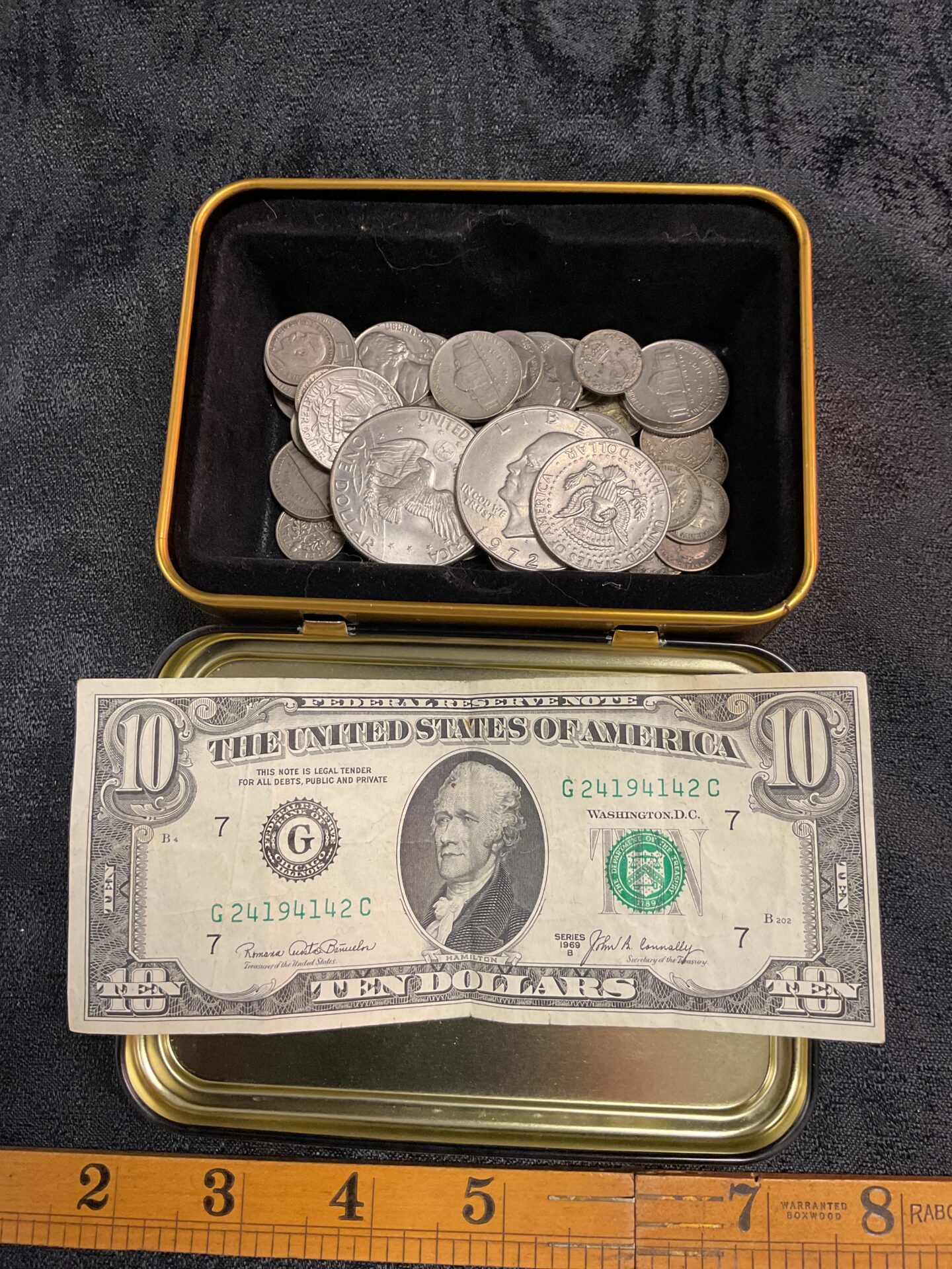 783 Tin of American Coins and a ten dollar note