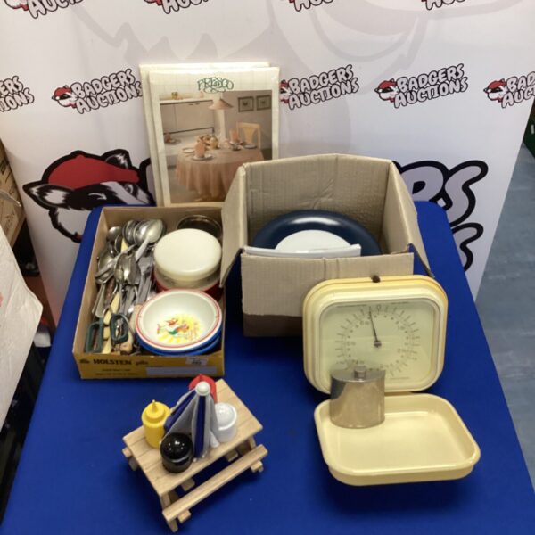 Vintage kitchenware lot with enamel pots and pans.