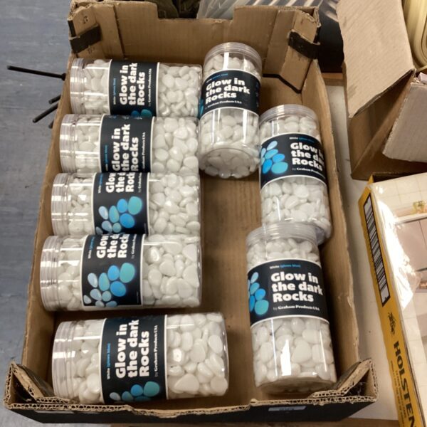 Eight tubs of glow-in-the-dark rocks for parties and decorations.