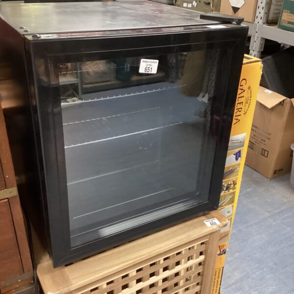 Black counter top wine cooler appliance for beverage storage.