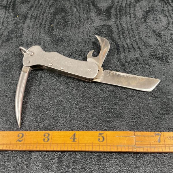 Open British Army Jack Knife from 1955 showing tools.