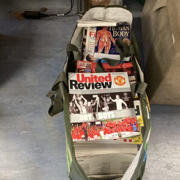 Large collection of vintage Manchester United football magazines.