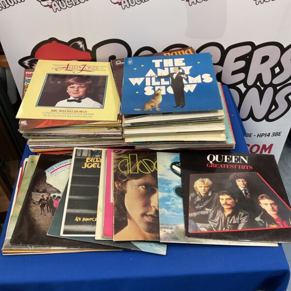 Vinyl record collection featuring Queen records, vintage music.