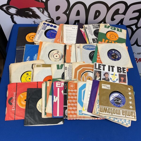 Vintage lot of 7 inch vinyl records for collectors.