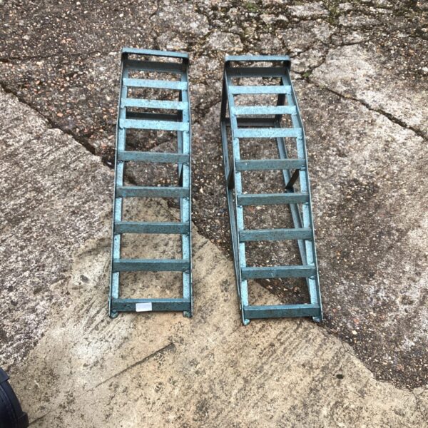 Pair of steel car ramps for vehicle maintenance and repair.
