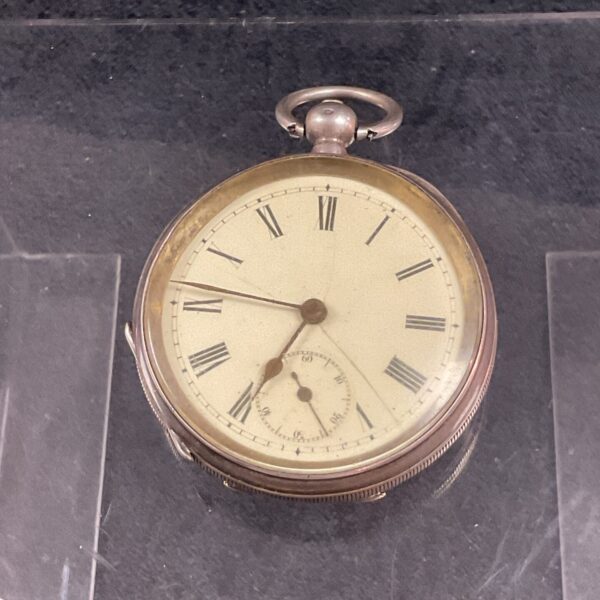 Antique 935 silver pocket watch with white enamel dial.