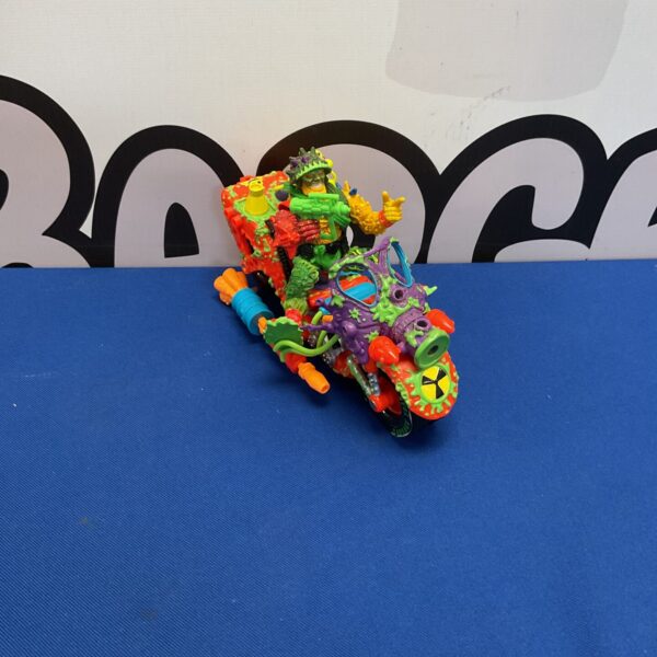 Vintage 1991 Toxic Crusader action figure on bike.