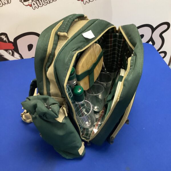 Green Gelert picnic rucksack with contents visible inside.