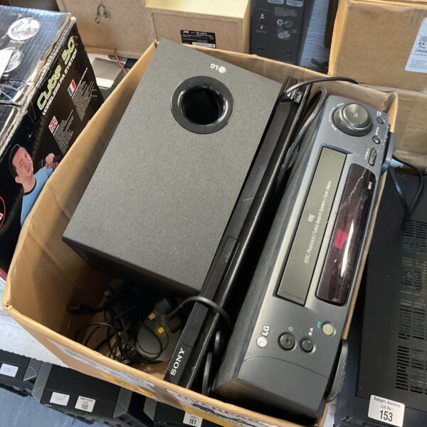 Sony Blu-ray player and LG VHS player with subwoofer setup.