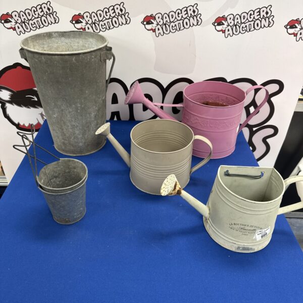 Selection of decorative garden water cans and a galvanised bucket.
