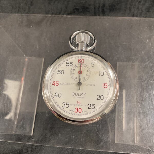 Vintage Dolly stopwatch by Caterer Cuss, London, a collectible timepiece.