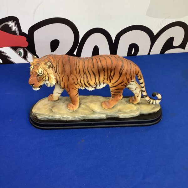 Detailed Academy tiger figurine on a rocky base.