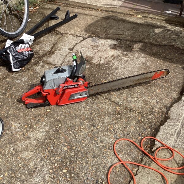 Vintage Jonsered 80 petrol chainsaw in used condition.