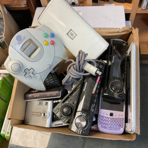 Mixed lot of vintage cameras, phones, and a Dreamcast controller.