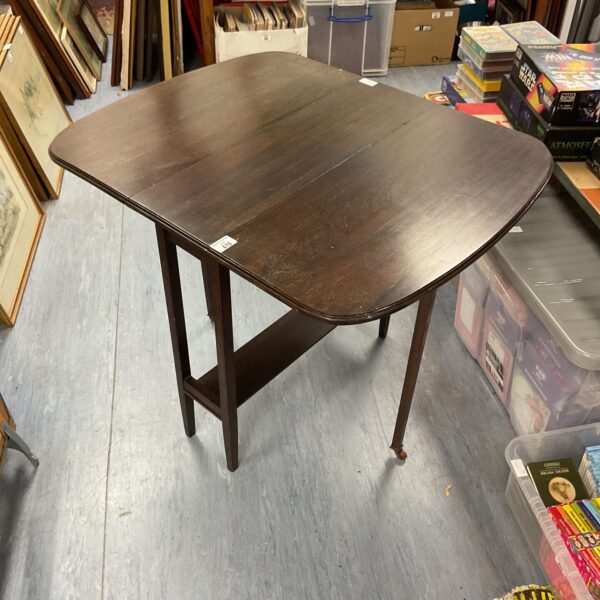Vintage oak gate leg table with ceramic casters.