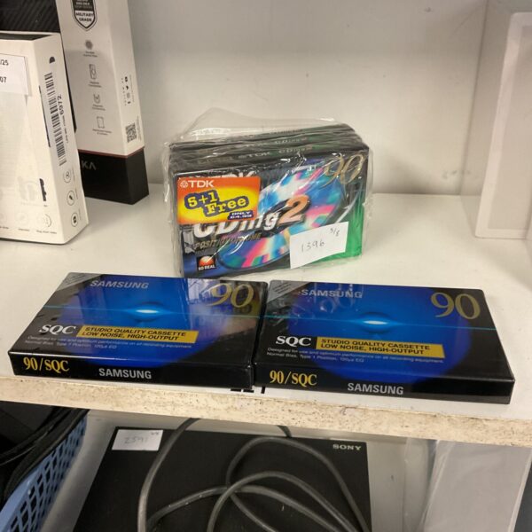 Sealed vintage audio cassette tapes from Samsung and TDK.