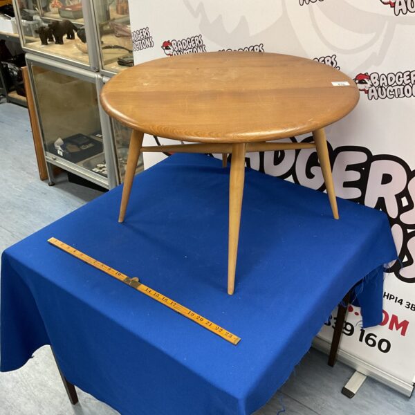 Vintage Ercol drop leaf coffee table in blonde wood.
