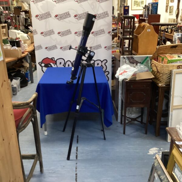 Used Bresser telescope on tripod for astronomy and stargazing.
