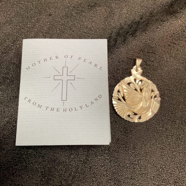 Hand-carved mother of pearl dove pendant from Jerusalem, peace symbol.
