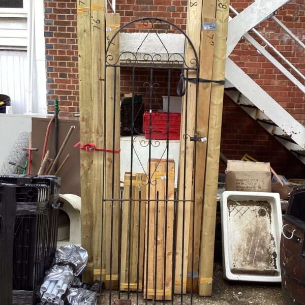 Vintage wrought iron garden gate with brackets, measuring 84 inches by 32 inches.