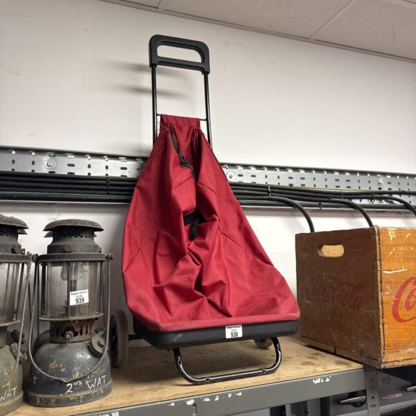 Vintage granny shopping trolley with drawstring top and metal frame.