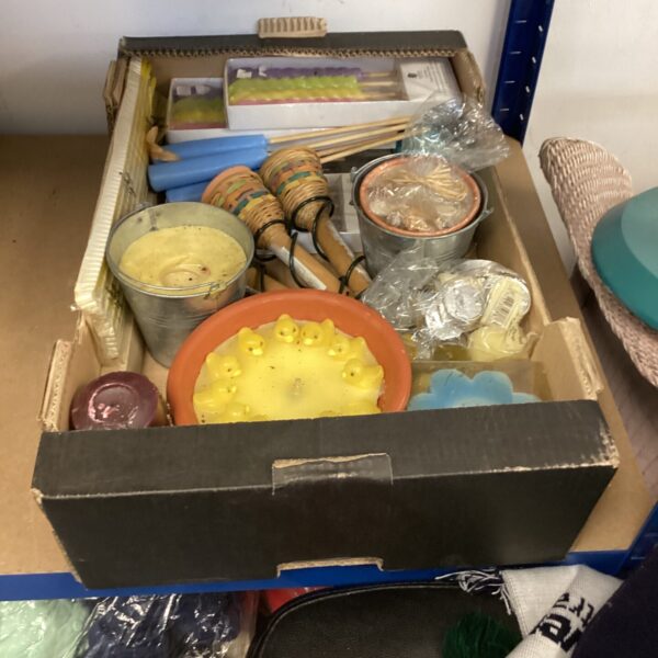 Assorted candles presented in a tray, a colourful candle collection.