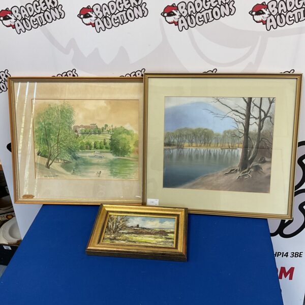 Vintage framed lake scene painting, serene landscape art.
