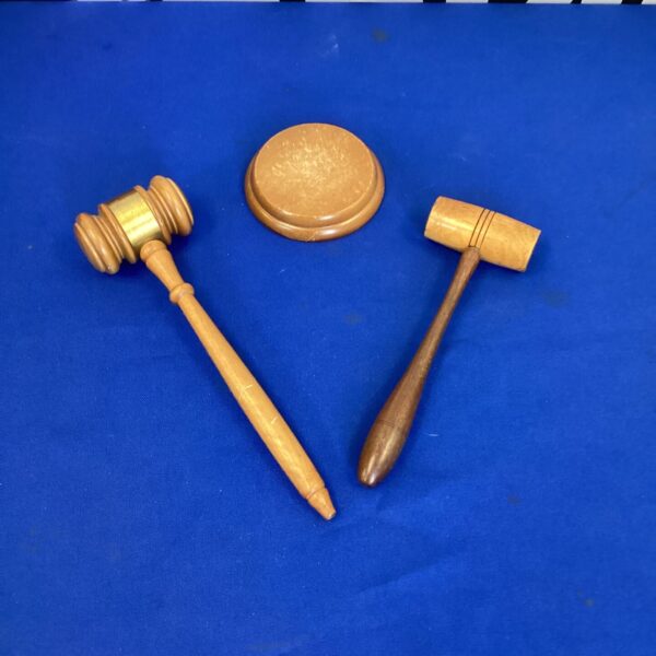 Two wooden auction gavels with bases, used by Badgers Auctions.