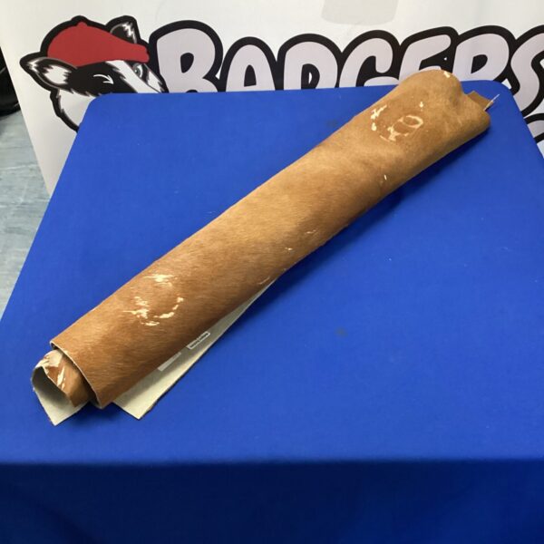 Natural cowhide roll for upholstery and crafting projects.