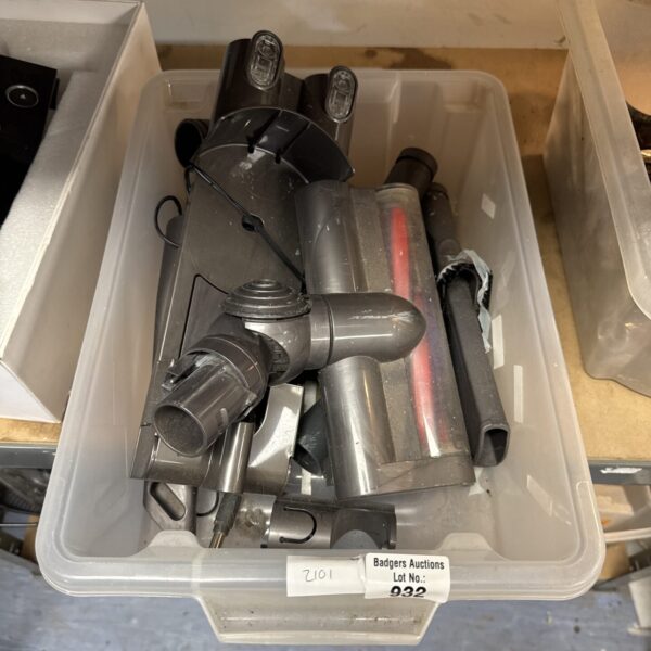 Tray of used Dyson cordless hoover parts for repair.