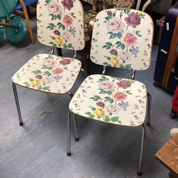 Vintage floral patterned dining chairs with chrome legs.