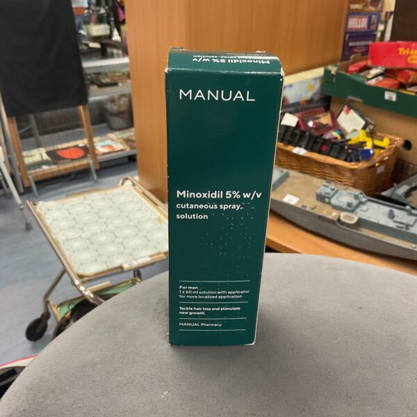 Manual Minoxidil 5% w/v spray solution bottle for hair loss treatment.