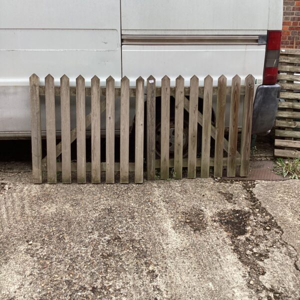 Rustic wooden garden gates with a classic picket design.