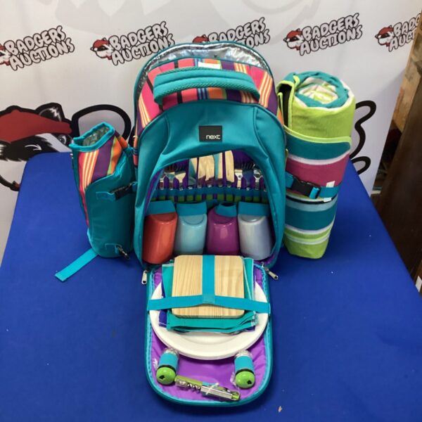 Colourful picnic rucksack set with containers and accessories.