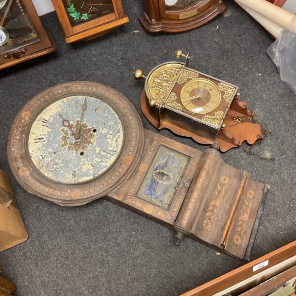 Antique American wall clock face needing restoration.