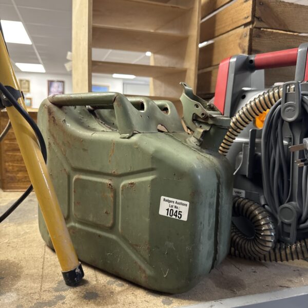 Vintage metal jerry can, showing signs of age and wear.