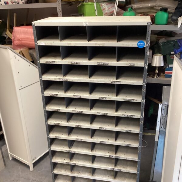Large metal storage unit with multiple compartments for organization.